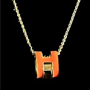 Classic Letter H Design Orange Enamel / Gold tone necklacd.